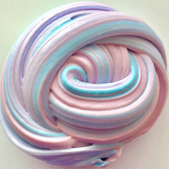 there is a pink and blue swirled object on the wall