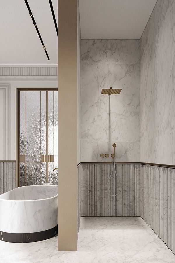 a bathroom with marble walls and flooring next to a bathtub in the corner