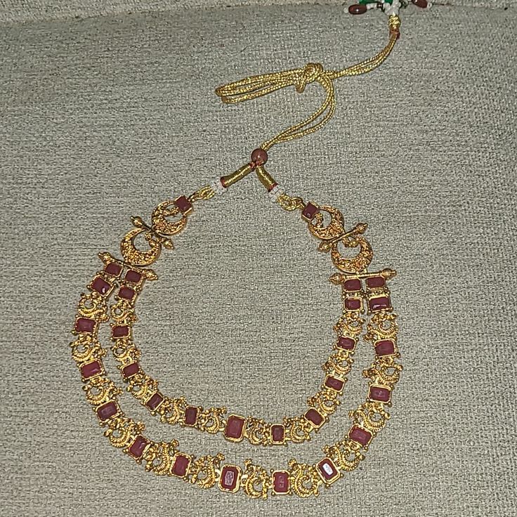 Double Layered Necklace And Earrings Gold Maroon Red Color Bollywood Indian Jewelry Red Dangle Necklaces For Festive Occasions, Festive Red Temple Jewelry Necklaces, Traditional Red Dangle Necklace, Red Handmade Temple Jewelry Bridal Necklace, Handmade Red Temple Jewelry Bridal Necklace, Handmade Red Jewelry Sets For Festive Occasions, Handmade Red Jewelry Sets For Festive Season, Handmade Red Temple Jewelry Set, Adjustable Red Jewelry For Celebration