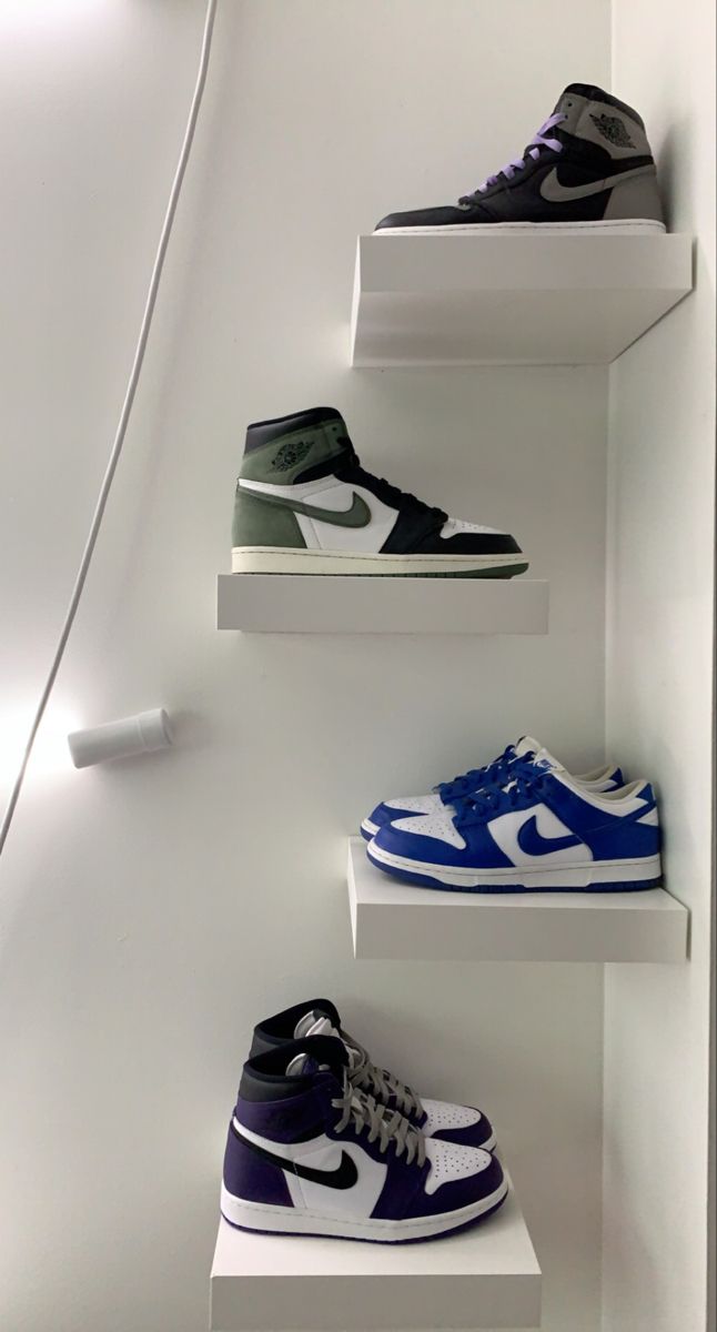 three shelves with different shoes on them