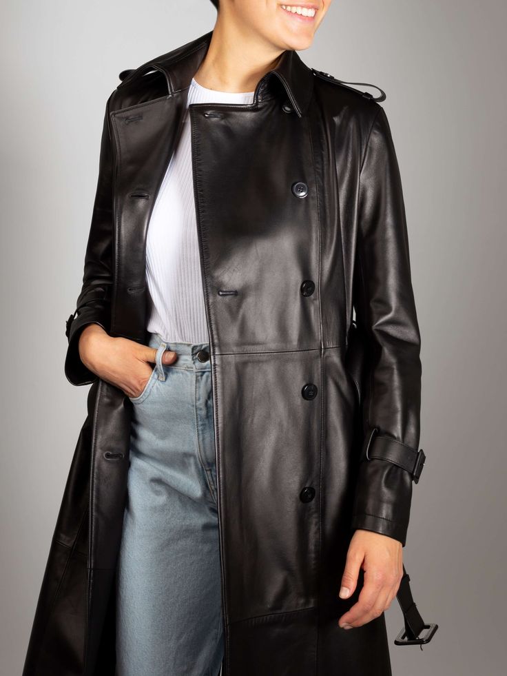 Over 100 years of history in one leather coat. Our Sandra Italian Lambskin Leather Trench Coat is truly timeless leather outerwear, you could pass it down from generation to generation. It is suitable for all seasons. Wear it with a jacket for a formal look or with jeans and a T-shirt during your free time. Classic Soft Leather Outerwear For Fall, Classic Soft Leather Outerwear, Luxury Business Outerwear With Leather Lining, Timeless Leather Outerwear For Business, Winter Soft Leather Outerwear, Classic Black Outerwear With Leather Lining, Luxury Black Outerwear With Leather Lining, Classic Soft Leather Winter Outerwear, Classic Long Leather Pea Coat