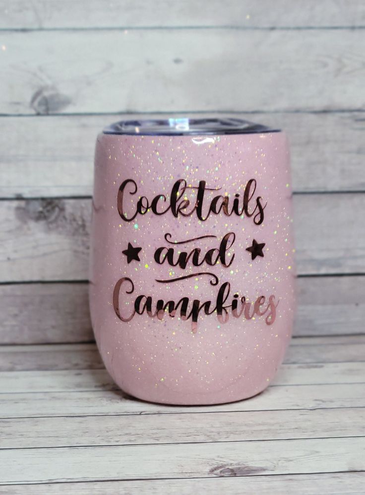 a pink tumbler with the words cocktails and campkins on it