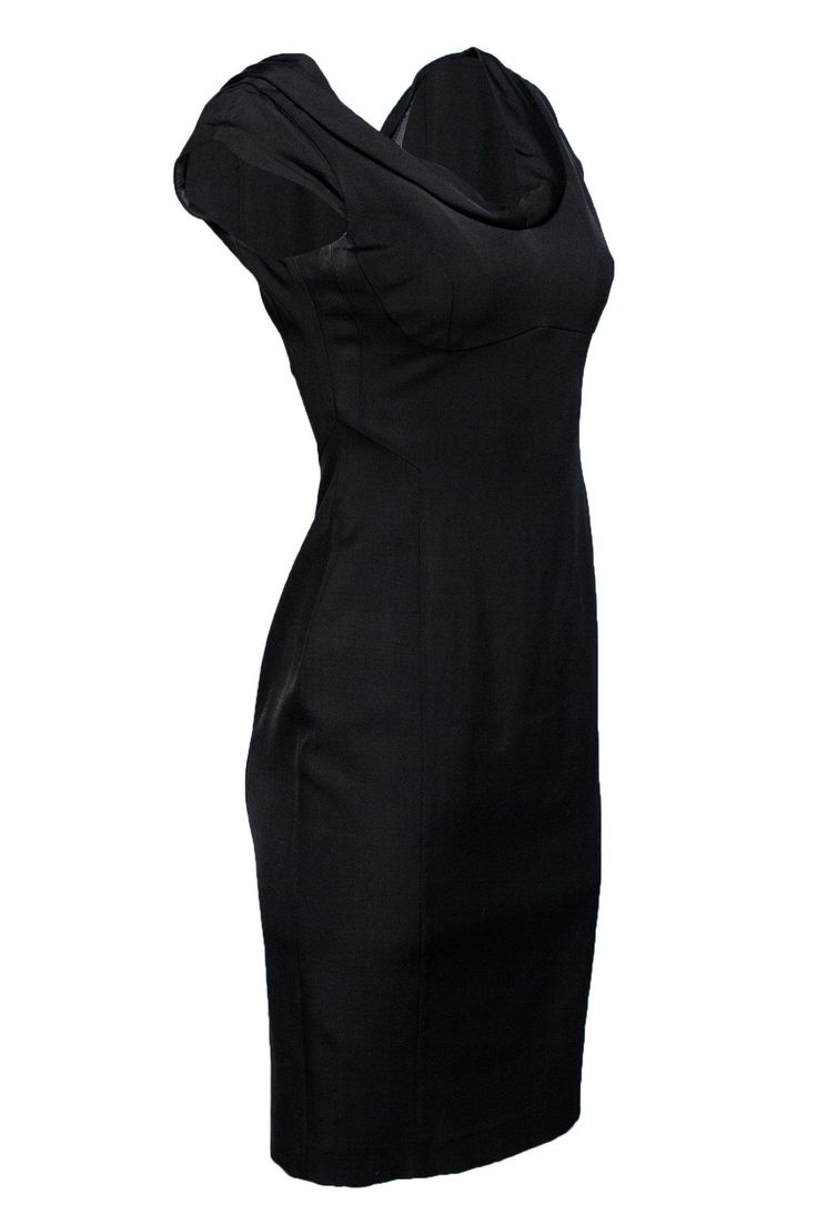 Need we say more? Grab this elegant Little Black Dress before someone else does! Everyone in needs a black dress, right? This one could be yours. Easily pairs with your favorite black heel for a timeless ensemble. Size 4 57% Viscose, 41% Modal, 2% Elastane Bodycon silhouette Cowl neck neckline Moulded bust Zippered back Waist 26" Bust 28" Total length 39" Classic Stretch Dress For Date Night, Sleek Fitted Solid Color Dresses, Classic Fitted Bodycon Dress For Cocktail, Classic Black Stretch Bodycon Dress, Classic Black Dress For Night Out, Black Formal Mini Dress With Fitted Bodice, Classic Fitted Bodycon Dress For Evening, Classic Black Dress With Fitted Bodice, Fitted Dressy Bodycon Dress For Formal Occasions