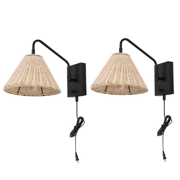 two black wall lights with wicker shades