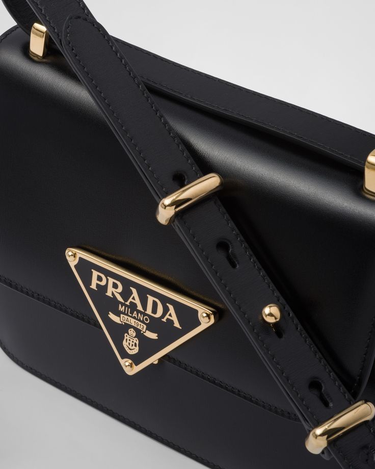 Adjustable leather handle Metal hardware Enameled-metal triangle logo closure Flap closure with push-lock logo buckle Nylon logo lining with patch pocket Bag Prada, Soft Leather Bag, Small Shoulder Bags, Prada Shoulder Bag, Ferragamo Belt, Fendi Belt, Triangle Logo, Saint Laurent Wallet, Dior Wallet