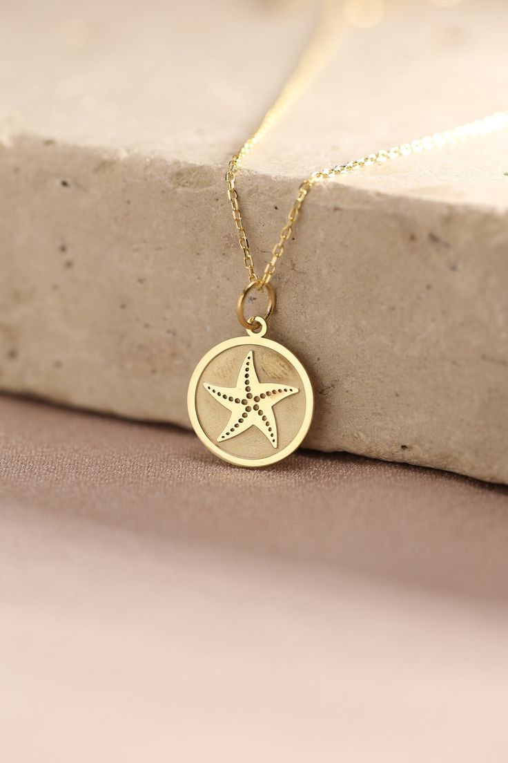 Gold Starfish Pendant - Seashell Gold Necklace ● Material of pendant: Solid Gold 14k ( REAL GOLD ) ● Metal Stamp: 14k ( REAL GOLD ) ● The pendant is available in 5 sizes: - 12,7 mm / 0.5 inches (Diameter) - 14,0 mm / 0,55 inches ( Diameter ) In the photos - 15,3 mm / 0.6 inches ( Diameter ) - 16,5 mm / 0,65 inches ( Diameter ) - 19,1 mm / 0,75 inches ( Diameter ) ( In the photos the size is 14mm / 0.55 inches Diameter ) ( Jump Ring inner diameter: 4 mm ) ● Material of chain: Solid gold 14k ( REA Ocean-inspired Charm Necklaces As Gift, Ocean-inspired Charm Necklaces As Gifts, Ocean-inspired Charm Necklaces For Gifts, Ocean-inspired Star Necklaces For Gifts, Ocean-inspired Charm Necklace For Gift, Yellow Gold Star Necklaces With Starfish Charm, Dainty Starfish Charm Jewelry For Gift, Dainty Starfish Charm Jewelry Gift, Yellow Gold Starfish Necklace As Gift