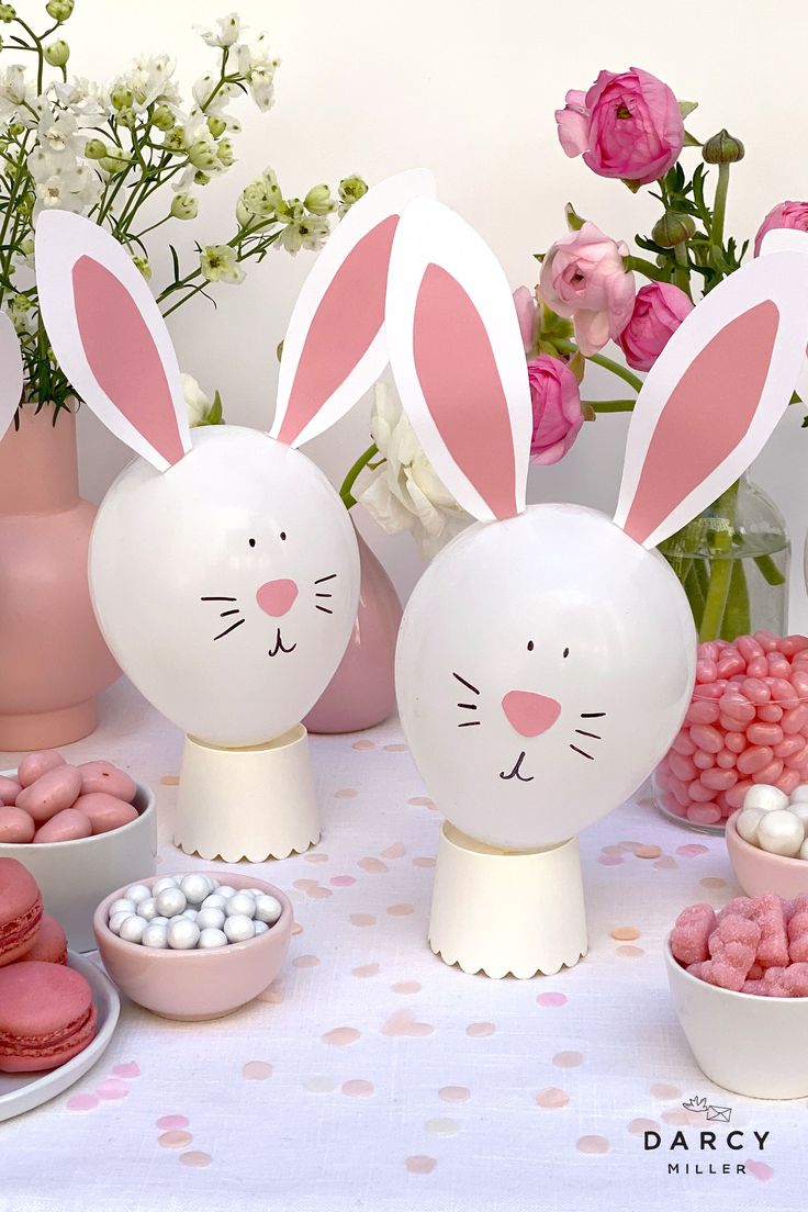 some bunny ears are on the table with other decorations