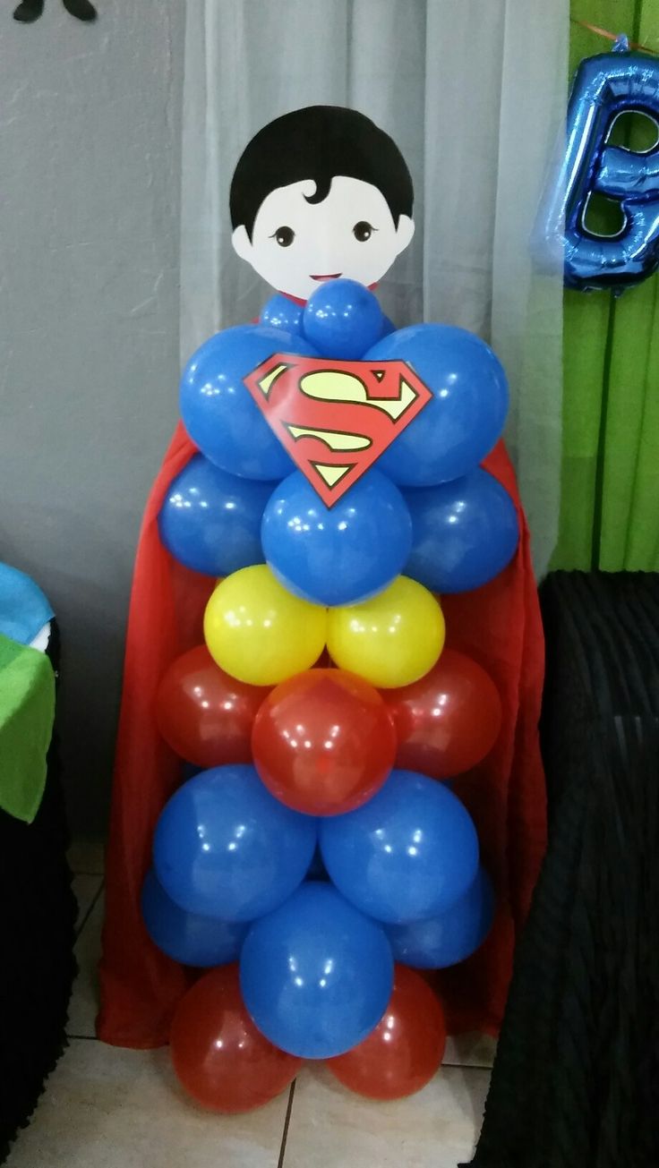 a bunch of balloons that are in the shape of superman