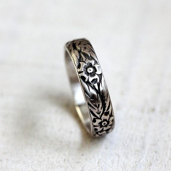 Sterling silver or gold floral pattern ring. This flower pattern ring makes a wonderful woman's wedding ring or a great everyday ring. I have oxidized the recesses to bring out the lovely detailed pattern of this ring. The band is a dome shape and measures 5mm high and 1.75mm wide at the widest point. Please note that there is a small seam where I have soldered the ring together. It is hard to detect but want to mention it. This ring is available in sterling silver and 14 karat yellow gold. The Silver Flower Ring, Pattern Ring, Sterling Silver Flowers, Womens Wedding Bands, Silver Band Ring, Gold Floral, Silver Flowers, Wedding Rings For Women, Silver Band