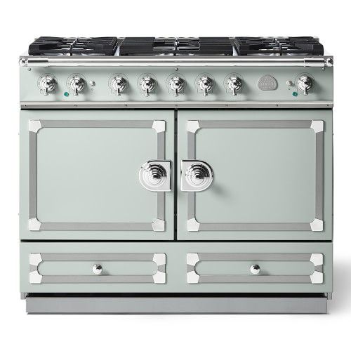 a white stove top oven sitting on top of a counter