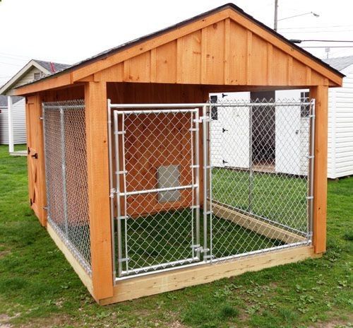 a dog house with a fence around it