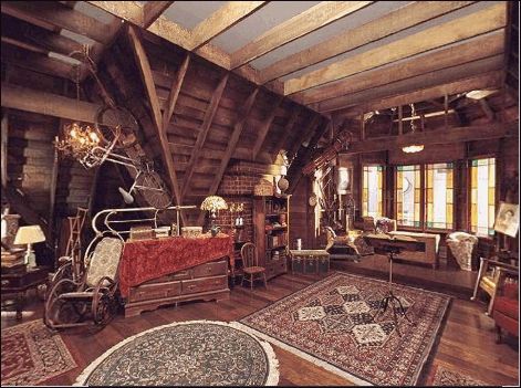 an old fashioned living room with wood floors and exposed ceilings, decorated in rustic style