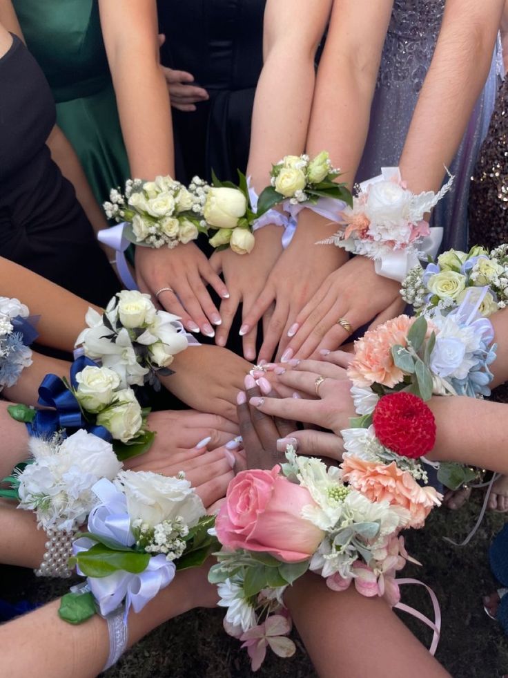 a group of people with their hands in the middle of each other's circle