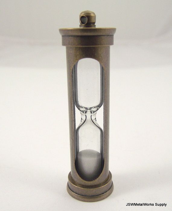 an old - fashioned hourglass is displayed on a white surface with space for text