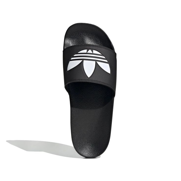 Style No. FU8298 Color: Core Black / Cloud White / Core Black Full-time vacation vibes. These Adilette Lite Slides free your feet. (Or wear them with socks, no judgment here.) This pair features a super-soft footbed for an instantly comfy feel. There's an adidas Trefoil on top so you can feel sporty, even when you're lounging. Slip-on Synthetic bandage upper Super-soft feel Cushioned sporty slides Synthetic outsole Sport Slippers, Vinyl Bag, Black Slides, Adidas Adilette, Adidas Trefoil, Clean Shoes, Slides Shoes, Helly Hansen, Mens Vans