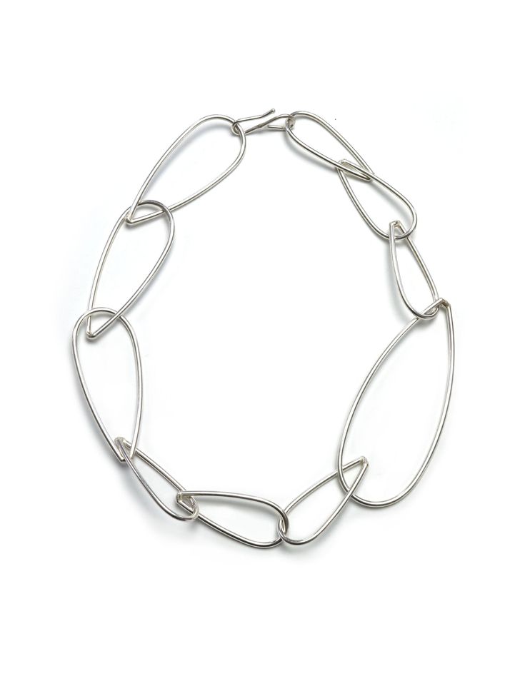 One big link punctuates this necklace for a stunning modern, minimal, easy to wear statement necklace. Wear it on its own or link and layer with other pieces in the Modular Collection for endless possibilities! Handmade in silver. Features an s-hook style clasp. Also available in steel and bronze. Necklace is approximately 19" long. The biggest links are 1 1/4" wide. Need more length? Check out our chain extenders. Comes in a gift box, tied with a ribbon. Treat yourself or a loved one! Made to order: please allow 2-3 days for your necklace to ship. FREE shipping on all US orders over $125! Minimalist Sterling Silver Chunky Chain Jewelry, Modern Silver Necklace With Rectangular Links, Minimalist Chunky Chain Oval Link Jewelry, Minimalist Chunky Chain Jewelry With Oval Links, Minimalist Chunky Paperclip Chain Jewelry, Modern Everyday Silver Chain Jewelry, Modern Silver Link Chain Jewelry, Minimalist Oval Link Necklace With Hooks, Modern Silver Paperclip Jewelry