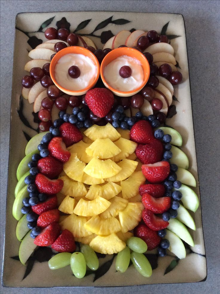 an owl made out of fruit on a plate