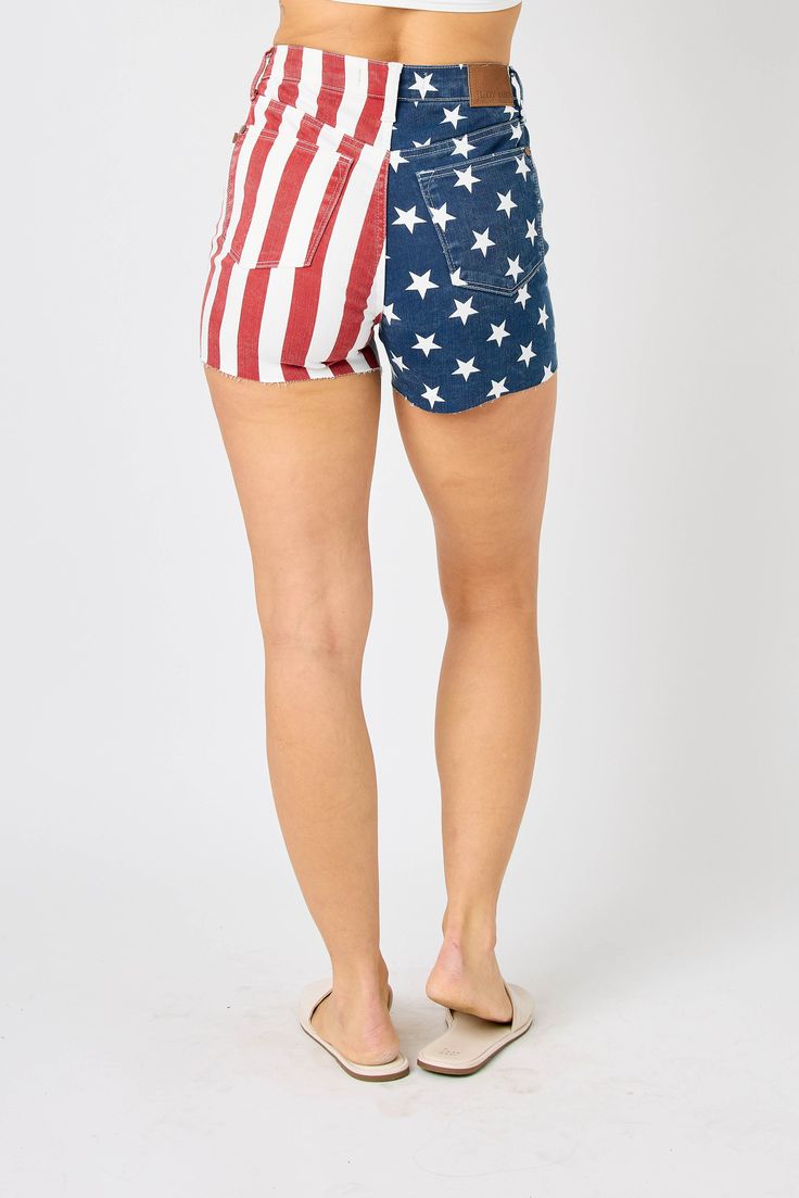 Show off your patriotic side with these Judy Blue High Rise Americana Flag Fray Hem Shorts! Made with quality denim, these shorts feature a high-rise waist and a trendy frayed hem for a stylish and comfortable look. Perfect for any summer occasion, these playful shorts are a must-have addition to your wardrobe. Plus, the raw hem adds an extra quirky detail to your outfit. Rise: 11'' Inseam: 3.5'' 93% Cotton, 6% Polyester, 1% Spandex Judy Blue Sizing: S: 0-3 M: 5-7 L: 9-11 Judy Blue 150273 72524 Isle Of Man, Blue Star, British Indian, Papua New Guinea, Striped Shorts, American Flag, Denim Shorts, High Rise, Flag