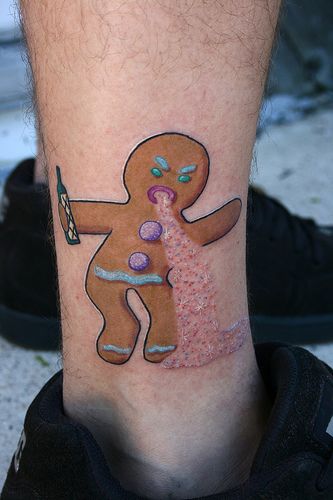 a man with a tattoo on his leg has a ginger and pink sprinkles