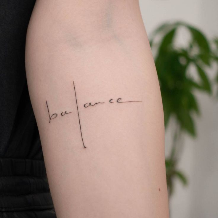 a woman's arm with the word be nice written in cursive font