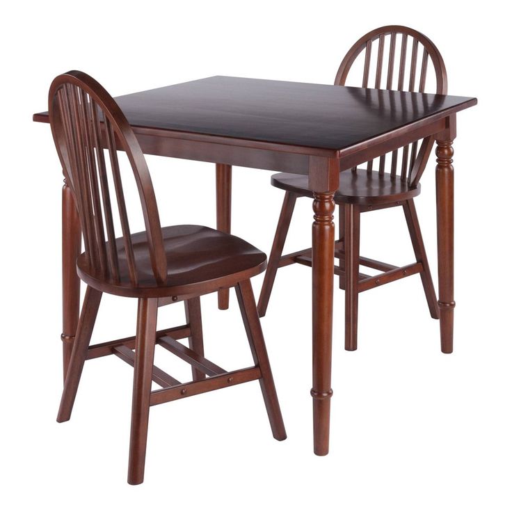 a wooden table with two chairs next to it