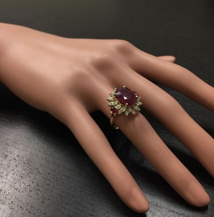 6.00 Carats Impressive Red Ruby and Diamond 14K Yellow Gold Ring Suggested Replacement Value $4,800.00 Total Red Ruby Weight is: 5.25 Carats (glass filled) Ruby Measures: 12.14 x 9.65mm Natural Round Diamonds Weight: .75 Carats (color G / Clarity SI1) Ring total weight: 5.8 grams Disclaimer: all weights, measurements and colors are approximate and may vary slightly from the listed dimensions or as seen in the image. All pictures are magnified to show the smallest of details. Please, refer to the Luxury Red Cluster Diamond Ring, Luxury Red Cluster Ring, Formal Pear-shaped Ruby Ring, Formal Red Pear-shaped Ruby Ring, Formal Cluster Ruby Ring, Classic Red Pear-shaped Rings, Luxury Ruby Cluster Ring With 17 Jewels, Classic Pear-shaped Red Rings, Luxury Ruby Cluster Jewelry