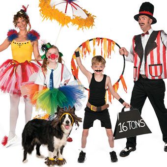 a group of people in costumes posing for a photo with a dog and two children