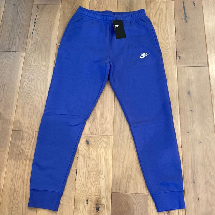 New With Tags Blue Tapered Leg Sweatpants For Loungewear, Blue Sportswear Joggers For Jogging, Blue Cotton Sportswear Joggers, Blue Sweatpants With Elastic Waistband For Jogging, Sporty Blue Cotton Pants, Blue Nike Sporty Joggers, Nike Blue Sporty Joggers, Blue Jogging Pants With Elastic Waistband, Blue Jogging Bottoms With Elastic Waistband