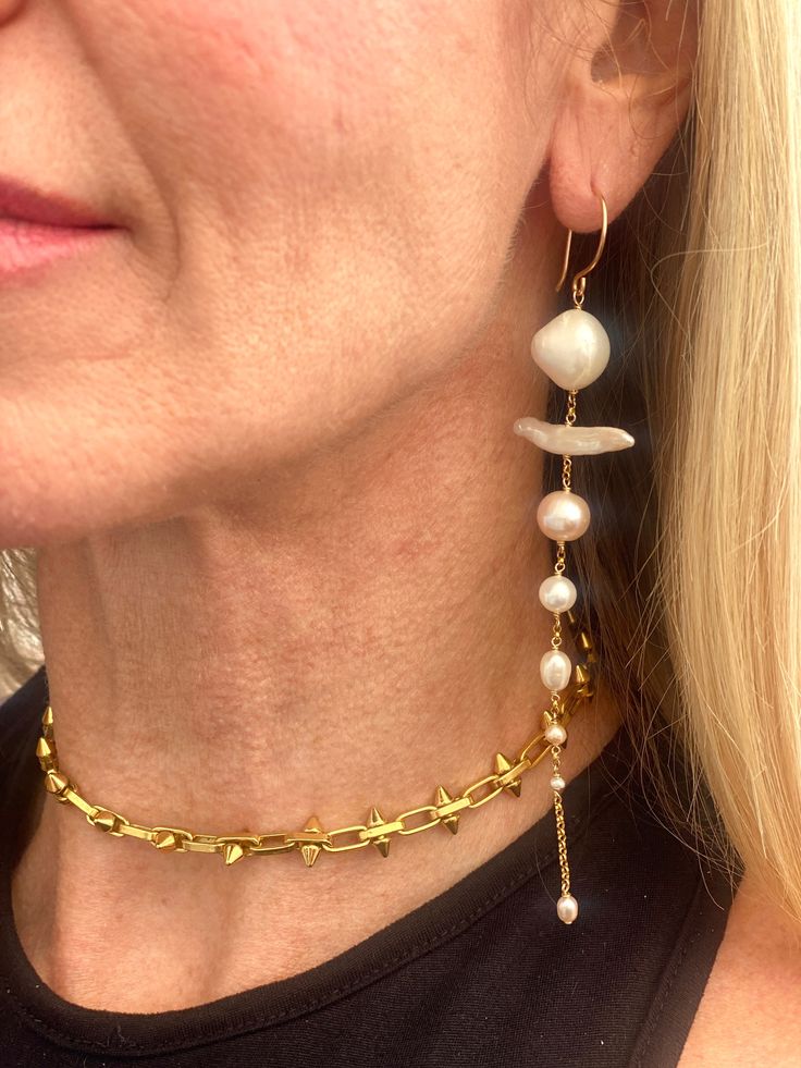 These beauties bring all of the drama. They feature eight cultured pearls each, each different from the next. Pearls are known for helping you tap into your inner wisdom. These earrings are modern, but also timeless classics. Modern Gold Jewelry With Pearl Drop, Modern Gold Long Drop Pearl Earrings, Elegant 14k Gold-filled Jewelry With Dangling Beads, Modern Pearl White Jewelry With Pearl Drop, Yellow Gold Long Drop Pearl Earrings, Gold Minimalist Jewelry With Dangling Beads, Minimalist Gold Jewelry With Dangling Beads, Pearl White Long Drop Pearl Jewelry, Gold-plated Long Drop Pearl Drop Earrings