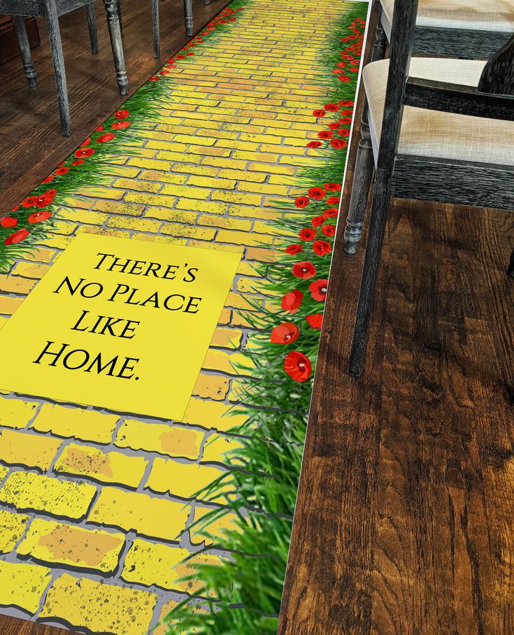 there's no place like home painted on the ground in front of a row of chairs