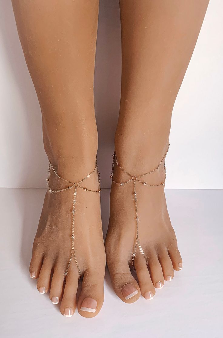 Amanda Rose Gold Barefoot Sandals are a stunning pair of barefoot sandals which features a minimalist design and barely there feel. Handcrafted using 1.5mm cable chain with tiny metal balls which are ingrained into the chain. Lobster clasp closure on the back of the sandals accommodates all foot sizes and does not restrict the movement of your feet. Wear them as a pair or individually. Perfect gift for a true minimalist. Sold as a pair. Gift Wrapped. Ships in 2 business days. All rights reserved Elegant Adjustable Barefoot Sandals For Beach, Adjustable Ankle Wrap Barefoot Sandals For Summer, Ankle Wrap Sandals As Summer Gift, Adjustable Barefoot Sandals For Summer Party, Gold Ankle Wrap Sandals For Beach, Elegant Barefoot Sandals With Single Toe Strap For Beach, Elegant Barefoot Sandals With Ankle Strap For Beach, Elegant Ankle Strap Barefoot Sandals For Beach, Elegant Barefoot Sandals For Summer Party