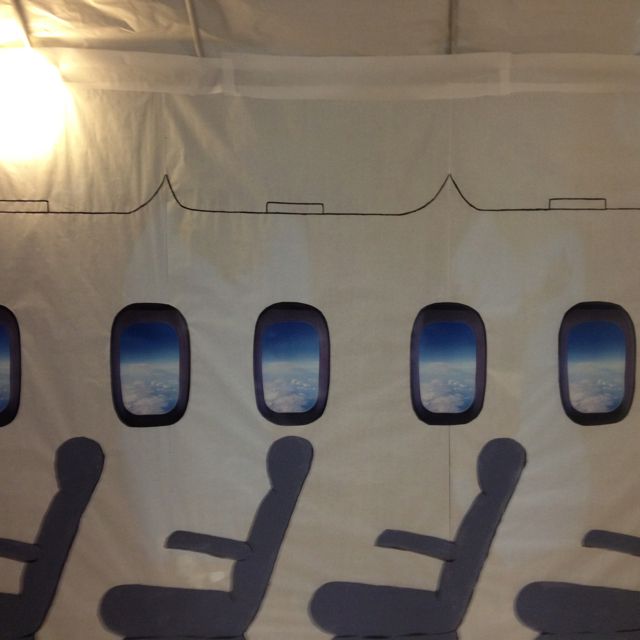 an airplane with four seats and the windows are shown in shadow, as seen from inside