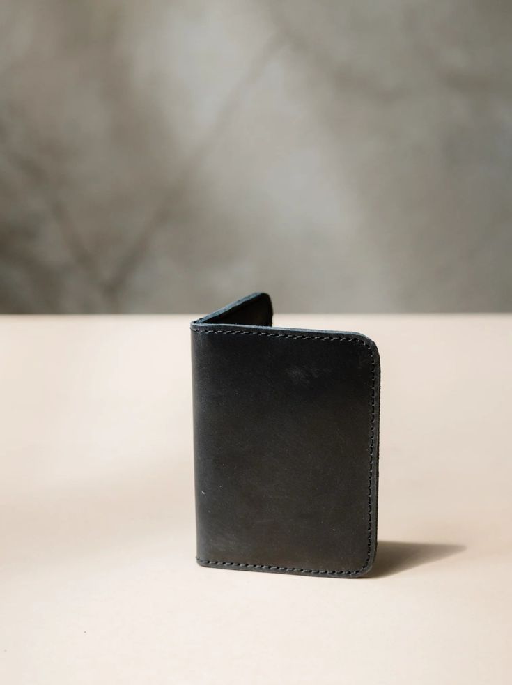 Introducing the ABLE Freddie Card Wallet in sleek black leather. Stay organized and stylish with this functional yet fashionable wallet. Perfect for keeping your cards and cash in one place on-the-go. The Freddie Card Wallet - Functional Trifold Wallets With Card Slots, Modern Trifold Card Holder For Daily Use, Functional Everyday Bifold Wallet, Functional Trifold Wallet With Interior Card Slots, Functional Bifold Wallet For Everyday Carry, Functional Bifold Wallets For Business, Functional Bifold Wallet For Everyday, Functional Bifold Wallet For Business, Functional Bifold Business Wallet