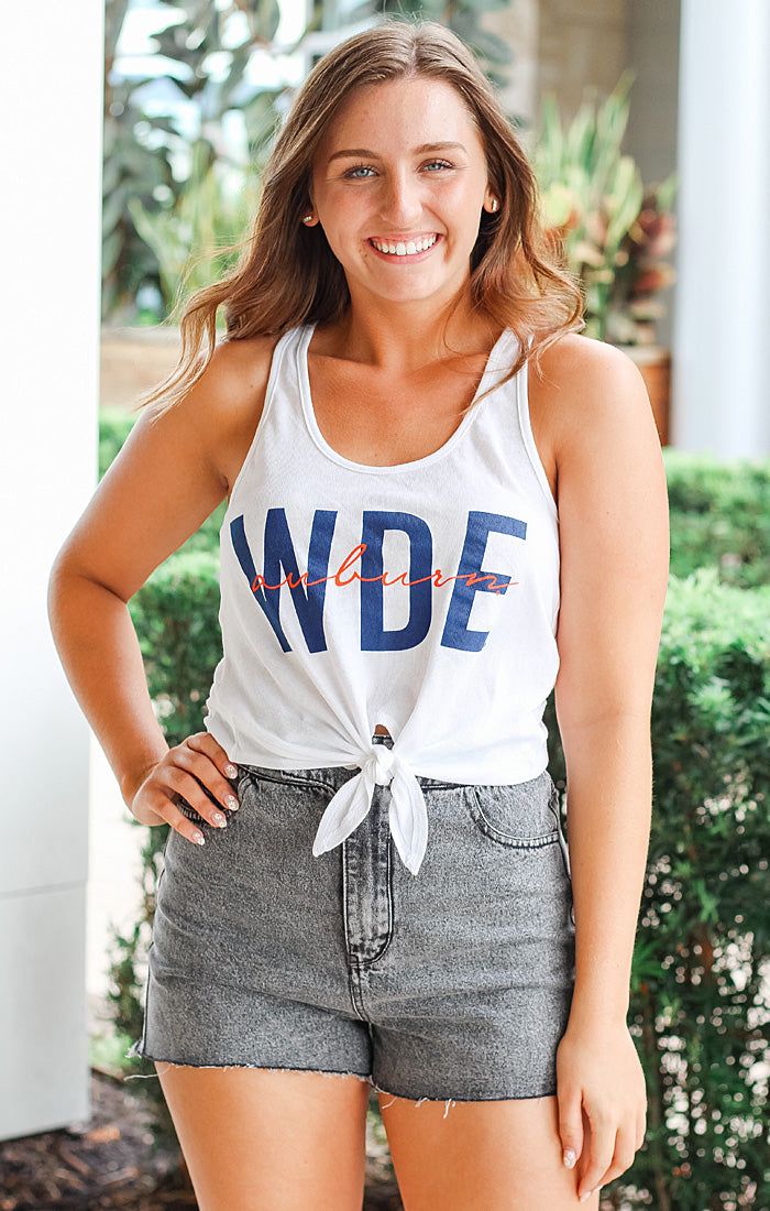 Looking for a cute gameday top? Introducing the Auburn Iconic High Waisted Tie Tank! This tank is perfect to pair with your favorite high waisted jeans or skirts for game day! This tank features the iconic Auburn color and has lightweight fabric and an adorable tie front detail! Details: *OFFICIALLY LICENSED* Auburn Tigers Sleeveless tank with scoop neckline Slightly Cropped Tie Front Detail Fabrication: 50% polyester, 38% Cotton, 12% Rayon Strapless Bra Friendly Dynver is wearing size Small Auburn Color, Semi Annual Sale, Sarasota Florida, Auburn Tigers, Trendy Clothing, High Waisted Jeans, Southern Style, Trendy Clothes For Women, Strapless Bra