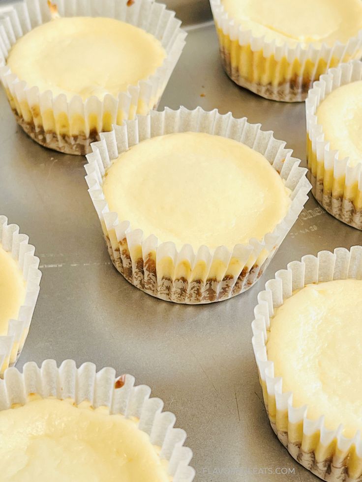 there are many cupcakes on the tray ready to be baked