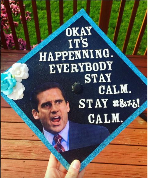 someone is holding up a graduation cap that says, okay it's happening everybody stay calm