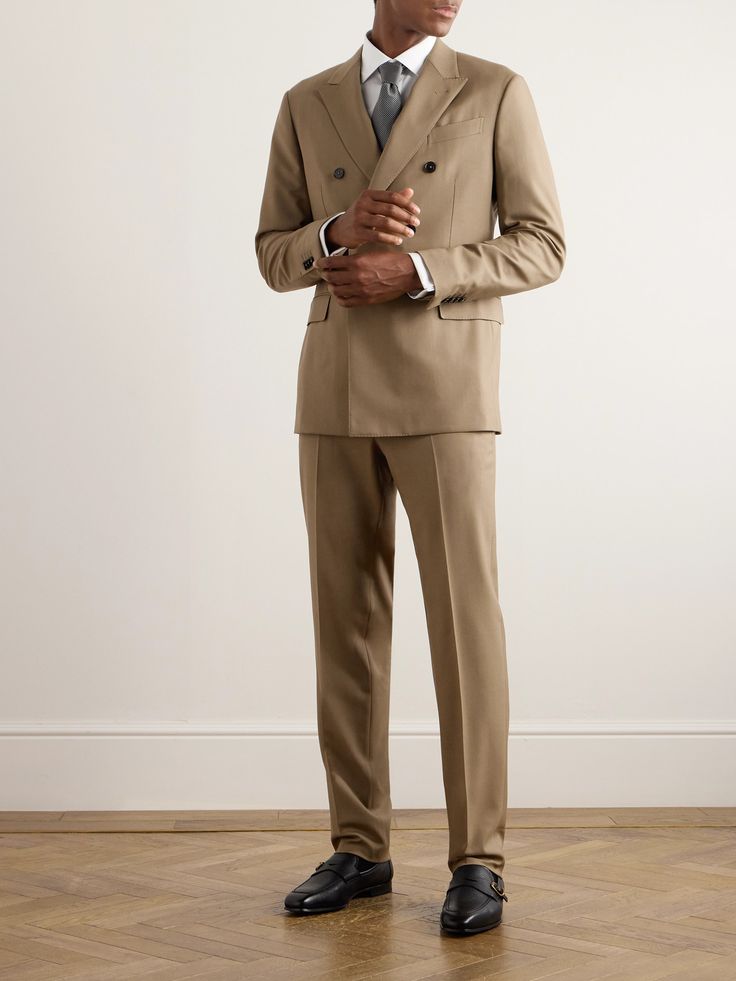 ZEGNA's suit is impeccably tailored from Trofeo™ wool-twill, an Australian fabric prized for its softness and breathability. Fully lined for structure, the jacket is cut in an elegant double-breasted profile with sharp peak lapels and contrasting button closures. The trousers have unfinished hems, so you can adjust the break. Double-breasted Wool Tuxedo For Work, Tailored Wool Double Breasted Suit For Work, Luxury Double-breasted Suits With Pressed Crease, Wool Double Breasted Suit With Pressed Crease For Work, Tailored Timeless Three-piece Suit For Workwear, Luxury Double Breasted Suit For Business Casual, Timeless Tailored Double-breasted Suits, Tailored Wool Double-breasted Tuxedo, Tailored Double Breasted Wool Suit