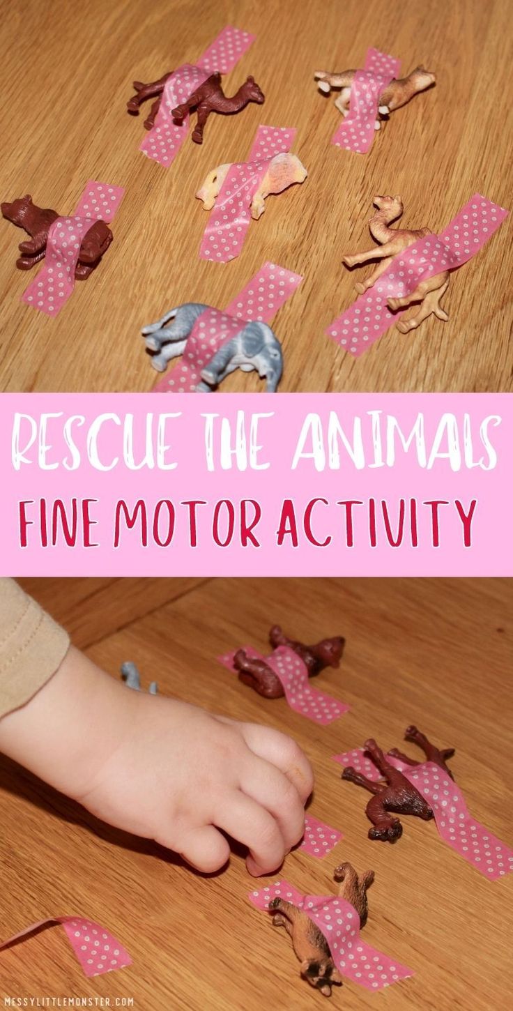 a child is playing with some pink paper animals on the floor and in front of them