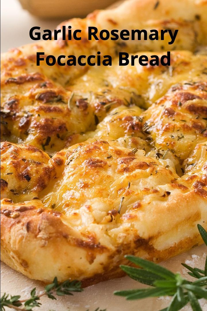 garlic rosemary focaccia bread on a cutting board