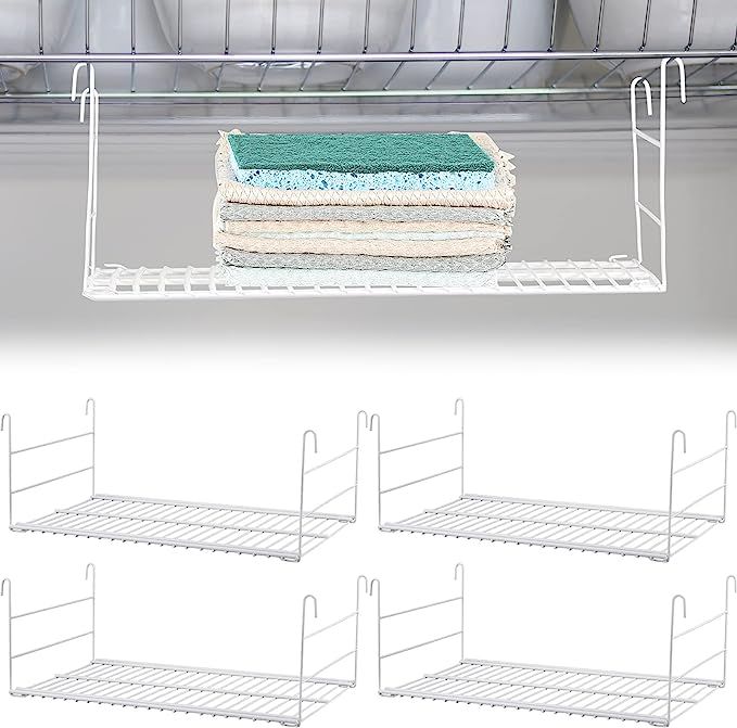 four white shelves holding towels and two sets of drying racks with hooks on each shelf