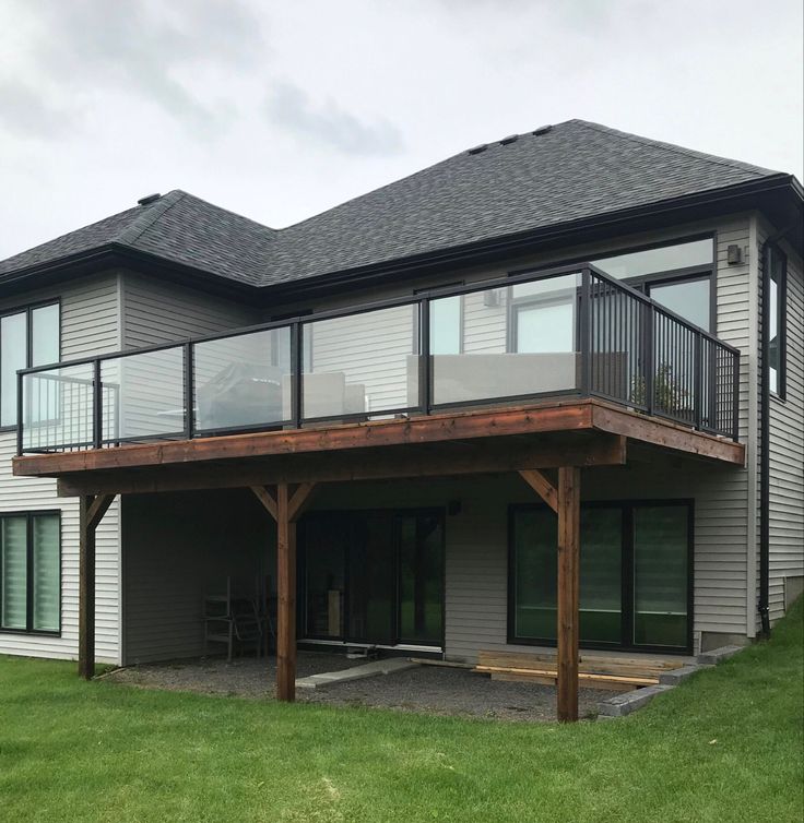 a large house with a deck on top of it