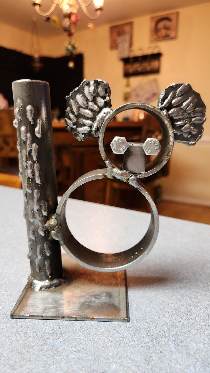 a metal object with two rings on top of it