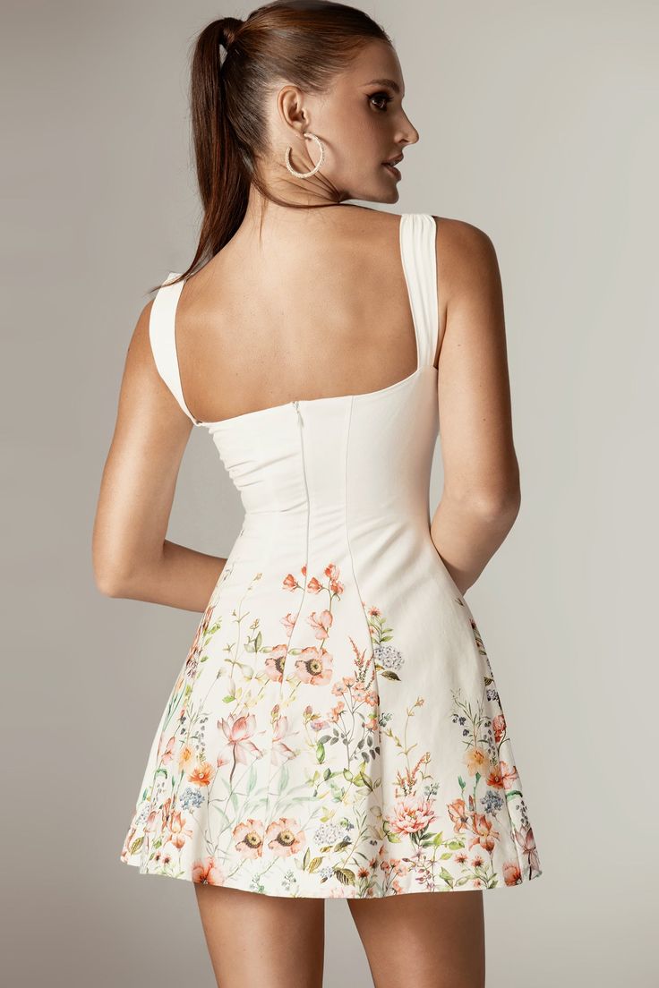 Infused with feminine details, our 'Keisha' floral mini dress is a must-have staple for your spring and summer wardrobe. Cut from a beautifully floral cotton fabric, it delicately skims your curves. The sweetheart neckline boasts a softly gathered bust and slender ties. The thigh-grazing cut features the prettiest ruffle hem in a flattering A-line shape, and it conveniently zips up the back for easy wear. Where To Wear: Perfect for pretty date nights, romantic dinner dates, gatherings with girlf Fall Dressing, Mini Dress Floral, Grecian Goddess, Cotton Mini Dress, Dinner Dates, Feminine Details, Romantic Dinner, Floral Mini Dress, Dress Floral