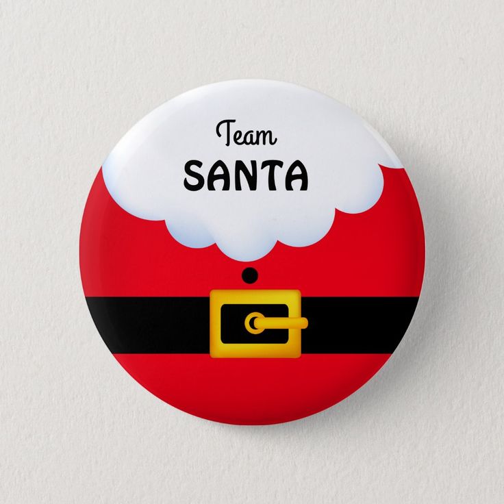 a santa claus button with the words team santa on it