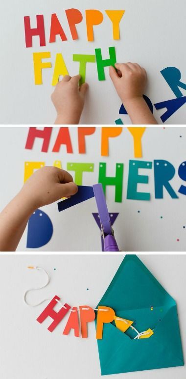 someone cutting out letters with scissors to make it look like they have happy fathers written on them