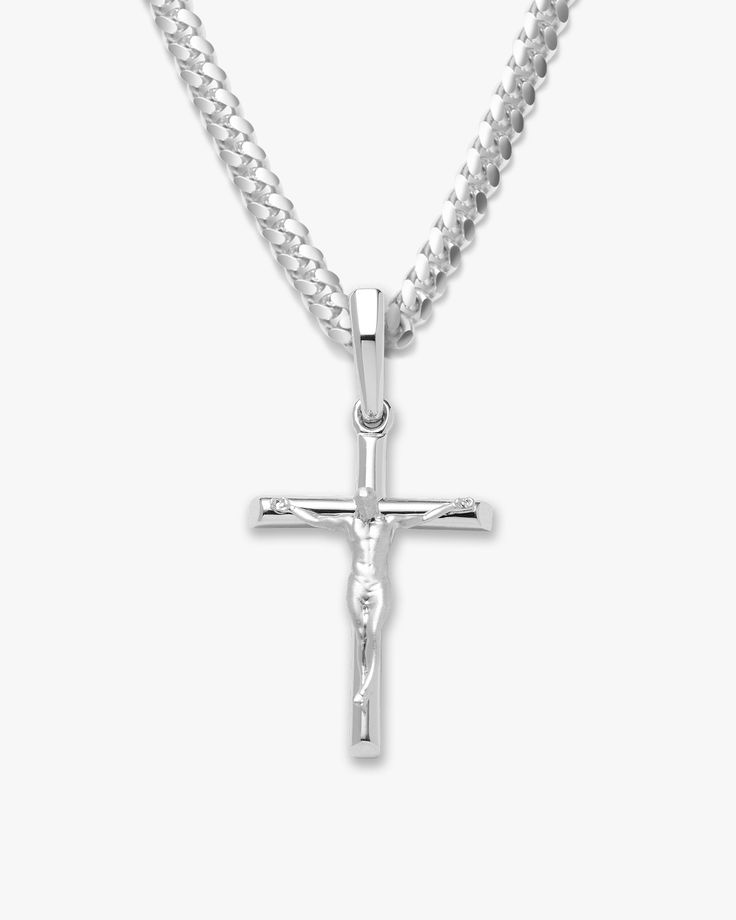 Choose the pendant that best expresses your beliefs. The silver Crucifix Pendant is one of the newest additions to our men’s pendant collection. We’ve crafted this silver pendant with the best materials to create a standout shine and be comfortable as it remains close to your heart. This men’s crucifix pendant necklace is an accessory you’ll never want to take off. See our gold crucifix necklace for a classic alternative. Gold Crucifix Necklace, Crucifix Necklace, Silver Cross Necklace, Solid Gold Chains, Silver Shop, Cuban Link Chain, Dream Jewelry, Men's Rings, Silver Cross