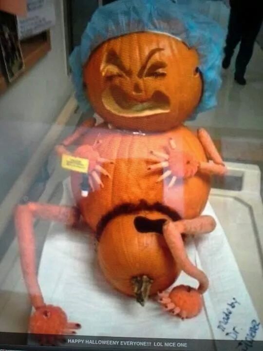 there is a pumpkin that has been carved to look like an old woman