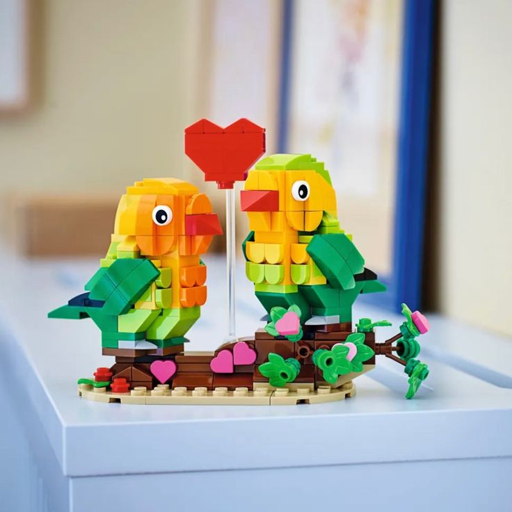 Delight Your Loved Ones With This Romantic Lego Valentine Lovebirds 40522 Building Kit. The Adorable Lovebirds Sit On A Branch Decorated With Pink Hearts And Flowers, While The Big Red Heart Symbolizes Their Love. This Sweet Set Is The Perfect Way To Express Love For Your Valentine And Makes A Great Anytime Gift For A Special Person. Express Your Love Build And Display A Tribute To Romance With This Lego Valentine Lovebirds 40522 Building Kit Give As A Gift This Lego Valentine Lovebirds 40522 Bu Lego Valentine, Lego Toy Story, Valentine Baskets, Valentine Tree, Valentine Gifts For Kids, Cute Valentines Day Gifts, Hearts And Flowers, Express Love, Valentine Theme