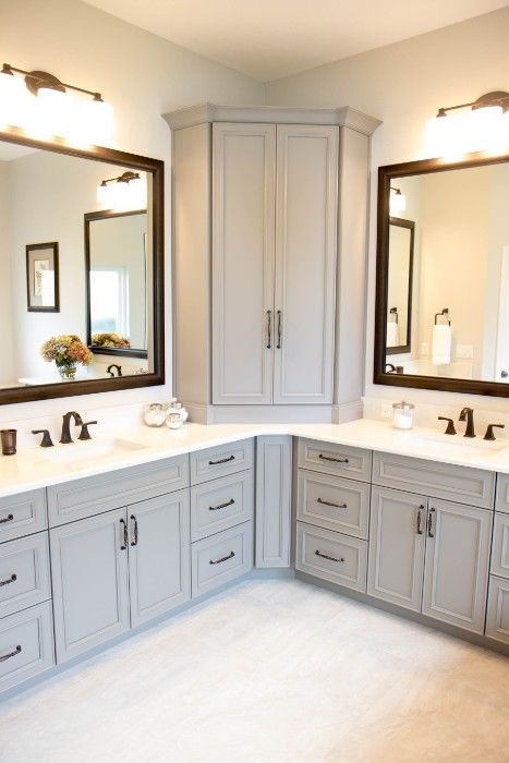 a large bathroom with double sinks and mirrors