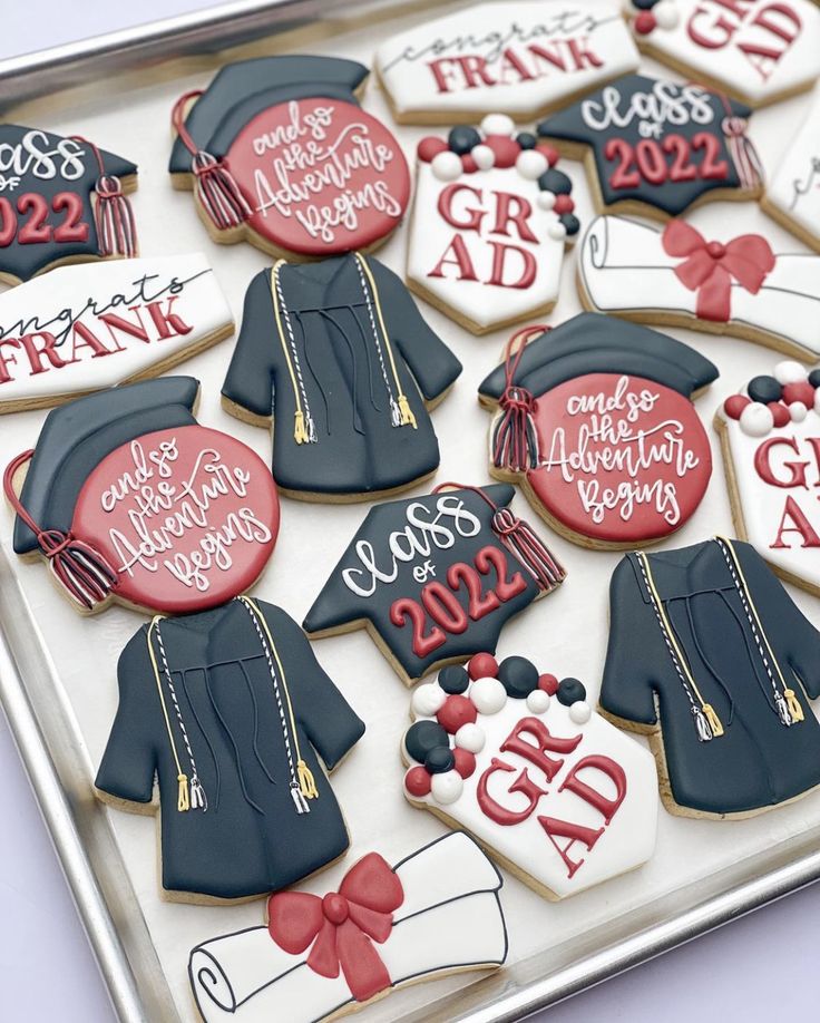 decorated cookies in the shape of graduation caps and gowns